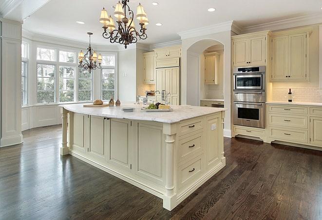 stylish bedroom with grey laminate flooring in Haddon Heights